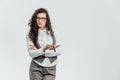 Young business lady with beautiful curly hair on a white background. During this, the marker holds in his hands, showing Royalty Free Stock Photo