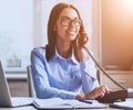 Young Business Lady Talking on Phone in Office. Royalty Free Stock Photo