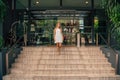 Young business lady walking down the stairs Royalty Free Stock Photo