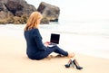 Business lady working with laptop computer on the beach Royalty Free Stock Photo