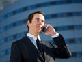 Young business man calling by mobile phone outdoors Royalty Free Stock Photo