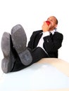 Young Business Man Eating Apple In Office Royalty Free Stock Photo