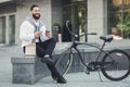 Young business man eating his lunch outdoors Royalty Free Stock Photo