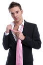 Young Business man, fixing his tie Royalty Free Stock Photo
