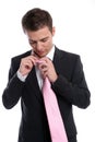 Young Business man, fixing his tie Royalty Free Stock Photo