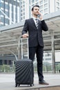 Young business man with formal suit talking mobile phone outdoor Royalty Free Stock Photo