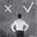 Young business man in front of a wall Royalty Free Stock Photo