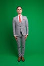 Young business man full body isolated on white and green background Royalty Free Stock Photo