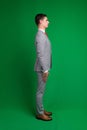 Young business man full body isolated on white and green background Royalty Free Stock Photo