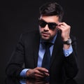 Young business man with hand on sunglasses Royalty Free Stock Photo