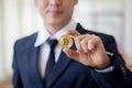 Young business man holding bitcion Royalty Free Stock Photo