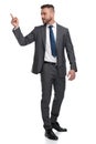 Young business man pointing finger at his back Royalty Free Stock Photo