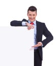 Young business man presenting a blank board Royalty Free Stock Photo