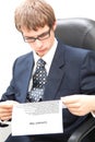 Young business man reading a curriculum vitae