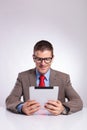 Young business man reading from tablet Royalty Free Stock Photo