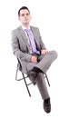 Young business man sitting on a chair Royalty Free Stock Photo