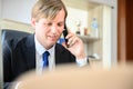 Young business man sitting at his desk working Royalty Free Stock Photo