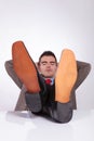 Young business man sleeps with feet on desk Royalty Free Stock Photo