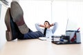 Young business man sleeps at workplace