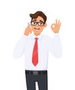 Young business man speaking or talking on the mobile, cell, smart phone. Male person showing, gesturing okay, OK sign with hand. Royalty Free Stock Photo