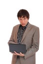 Young business man standing with laptop Royalty Free Stock Photo