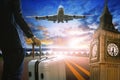 Young business man standing with luggage on urban airport runway Royalty Free Stock Photo