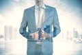 Young business man standing on bright city background with mock up place. Future, success and career concept. Double Royalty Free Stock Photo