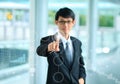 Young business man in a suit pointing with his finger to touch s Royalty Free Stock Photo