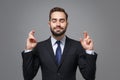 Young business man in suit shirt tie posing isolated on grey background. Achievement career wealth business concept Royalty Free Stock Photo