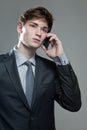 Young business man talking on cell phone Royalty Free Stock Photo