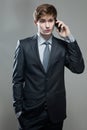 Young business man talking on cell phone Royalty Free Stock Photo