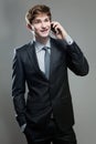 Young business man talking on cell phone Royalty Free Stock Photo