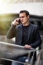 Young business man talking on cell phone at modern office Royalty Free Stock Photo