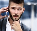 Young business man talking on cell phone Royalty Free Stock Photo