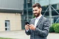 Young business man talking on a cell phone in the street Royalty Free Stock Photo