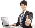 Young business man thumb up with laptop Royalty Free Stock Photo