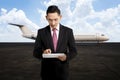 Young business man using his tablet on the airport Royalty Free Stock Photo