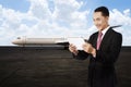 Young business man using his tablet on the airport Royalty Free Stock Photo