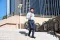 Young business man walking down stairs with a coffee cup in his hand Royalty Free Stock Photo