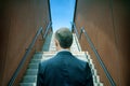 young business man walking stepping going up the stairs in modern city, go up, success, grow up. Royalty Free Stock Photo