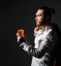 Young business man in white shirt and jacket drinking alcohol margarita cocktail drink with orange in martini glass Royalty Free Stock Photo