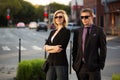 Young fashion business man and woman in city street Royalty Free Stock Photo