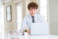 Young business man working with computer laptop at the office depressed and worry for distress, crying angry and afraid Royalty Free Stock Photo