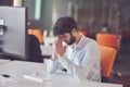 Young business man working on desktop computer at his desk in modern bright startup office interior Royalty Free Stock Photo