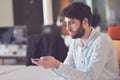 Young business man working on desktop computer at his desk in modern bright startup office interior Royalty Free Stock Photo