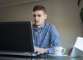 Young business man working on his laptop at home office Royalty Free Stock Photo