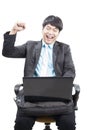 young business man working by internet online with laptop computer and fists up acting happy face isolated white background Royalty Free Stock Photo