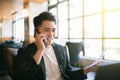 Young Business man  Working On Laptop and mobile phone In Coffee Shop Royalty Free Stock Photo