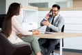 Business man speaking on the phone while in a meeting Royalty Free Stock Photo