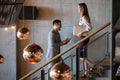 Young business people climb the stairs in the office building Royalty Free Stock Photo